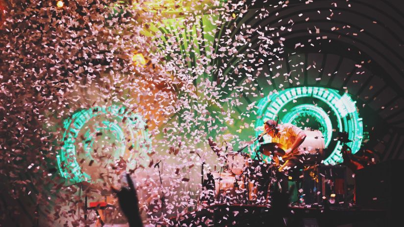 Confettis flying everywhere during an event with people dancing - Goa New Year Party 2023