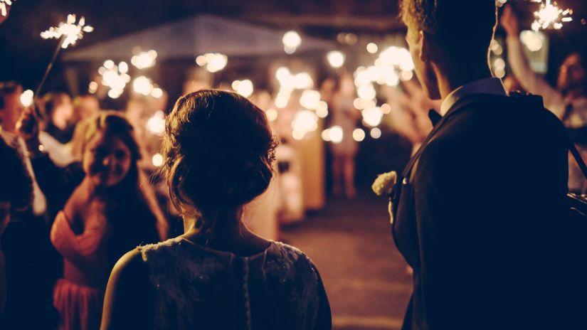 a woman entering a party filled with people