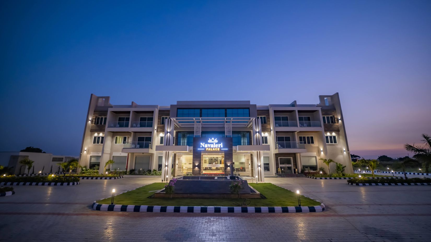 A wide-angle shot of the facade of Hotel Kyriad Prestige, Ilkal at night