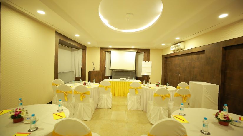 Conference room with yellow chairs at Mastiff Infantry, Bangalore 