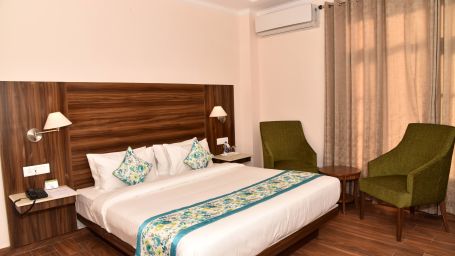 In the Super Deluxe Room with Balcony at Mastiff Hotel, Gopalpur, you'll find a cozy, comfortable, and king-size bed.