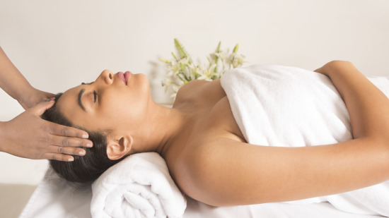 a person receiving a massage at the Spa at The Carlton 3