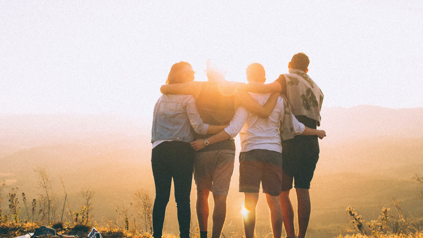 a group of people standing together in unity