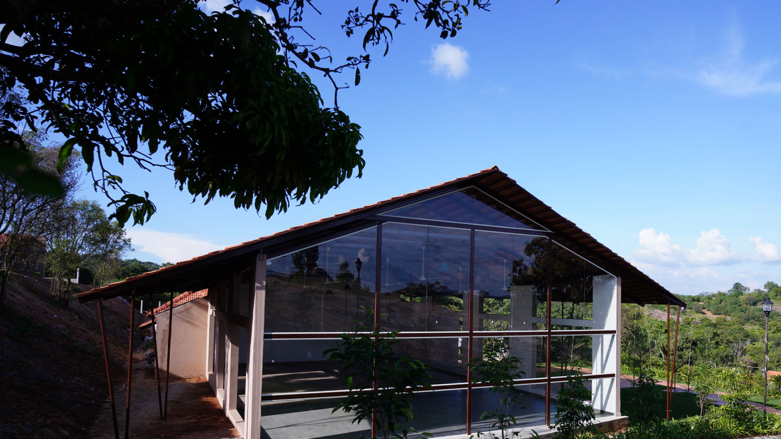 The sun shining on the facade of our banquet hall near Bangalore - Ravishing Retreat, Harisandra