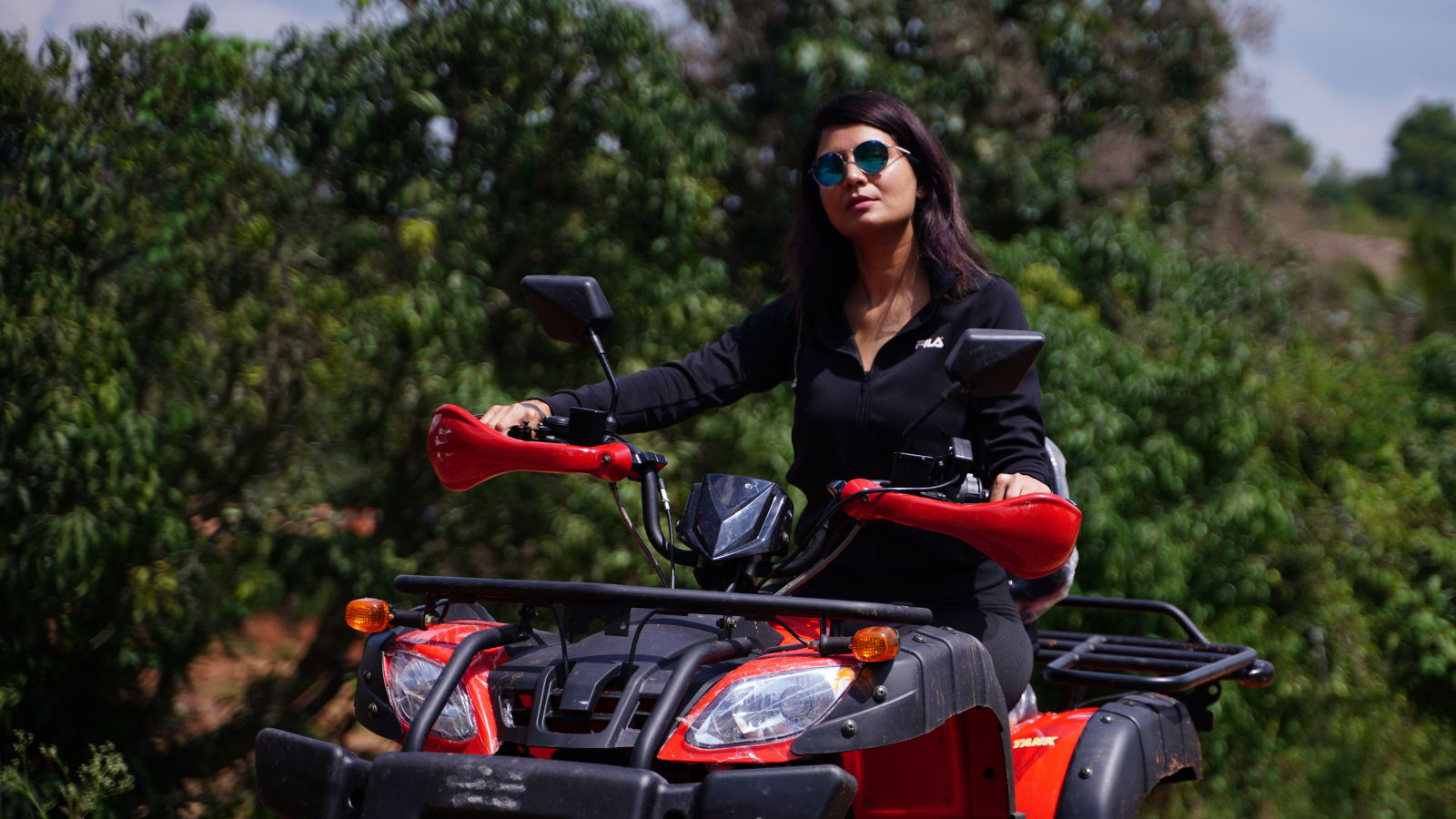 Ravishing Retreat Ramanagara - A guest riding the atv bike at our resort