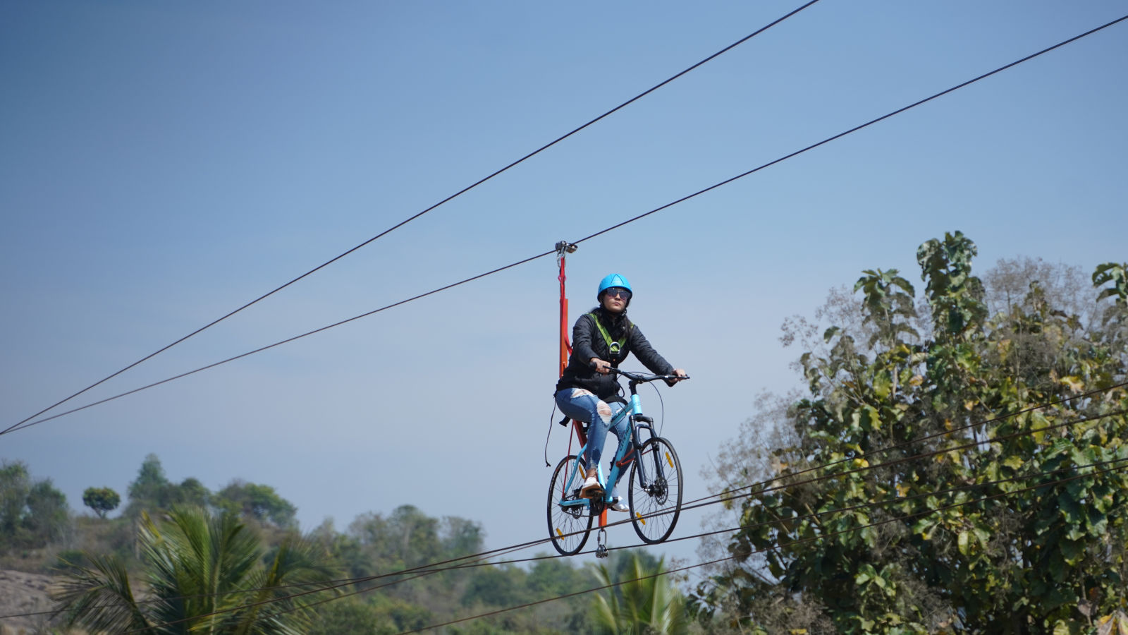 Ravishing Retreat Ramanagara - A guest zip cycling at our resory