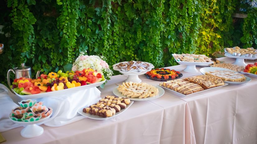 dessert and fruit station at a buffet kept on a table