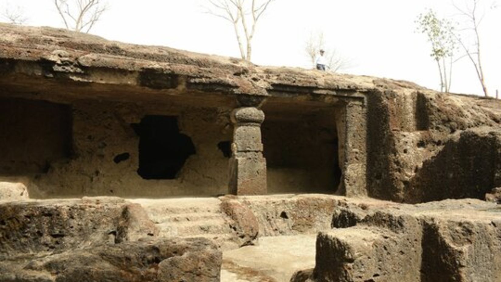 The entrance of Mahakali caves resembles an ancient ruin