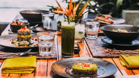 food served on a table beside a water body