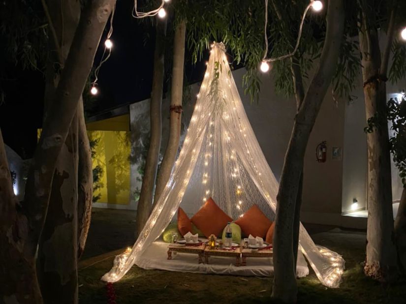 Candlelight dinner under a canopy