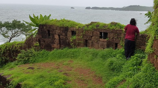 Person overlooking the Arabian Sea from Cabo De Rama Fort