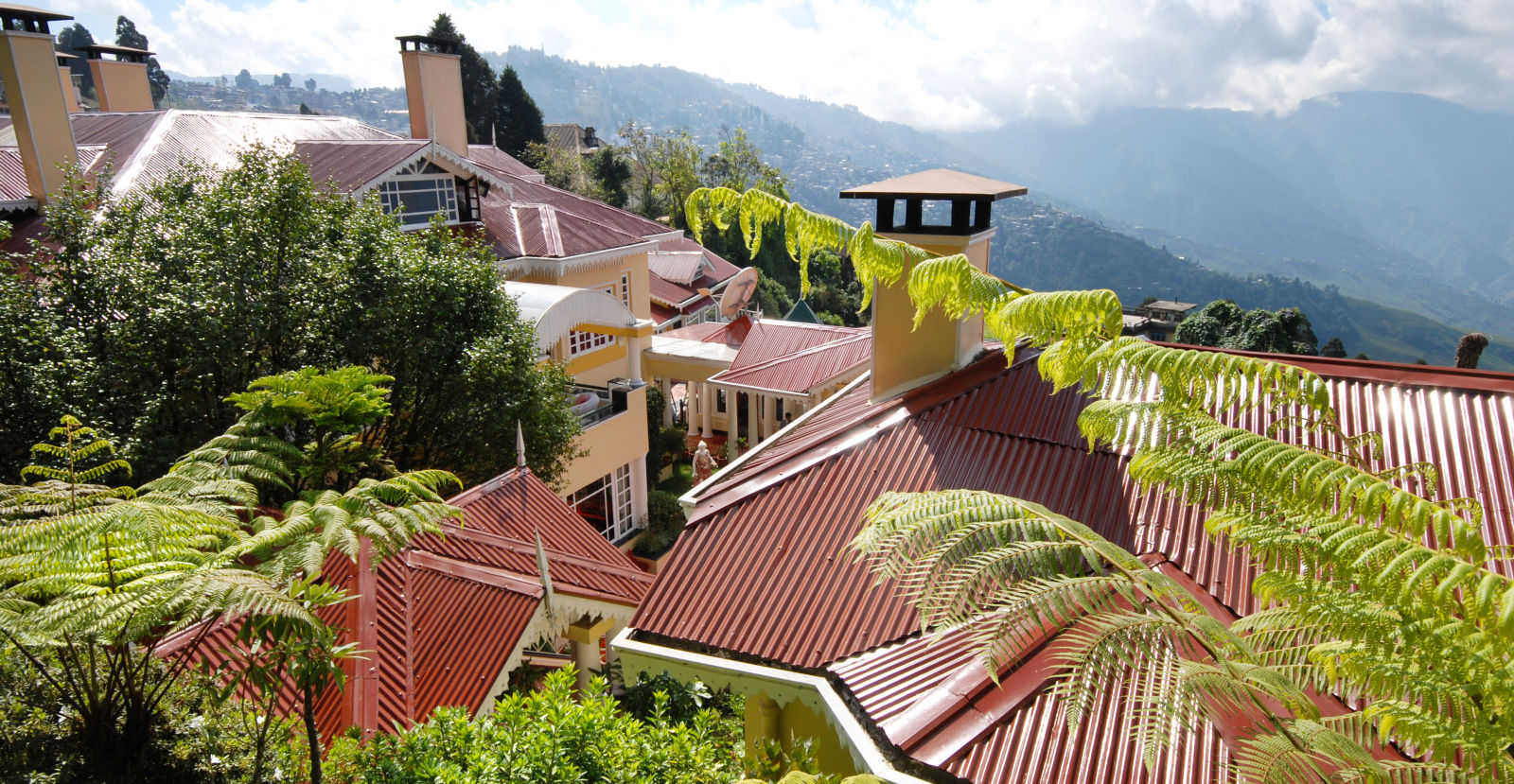 Best Mountain view hotels of Darjeeling - aerial view of the resort and the mountains - Mayfair Hill Resort, Darjeeling