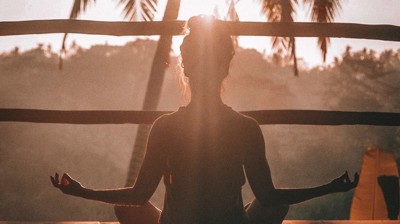 sillhouette of a person doing yoga 