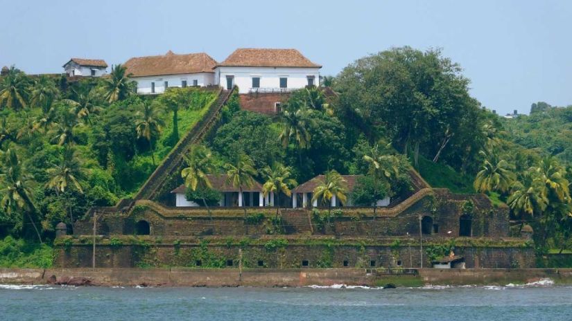 Lush greenery surrounding a fort on an island