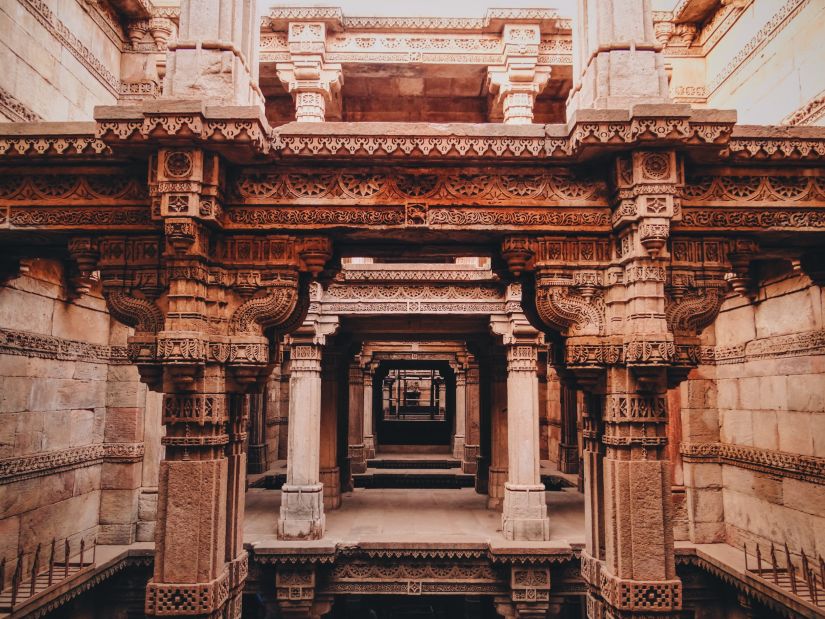 Beige coloured Stepwell with water below it