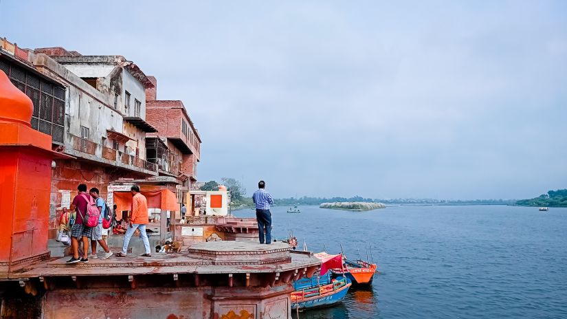 image of yamuna river in vrindavan during the day with people on the ghat