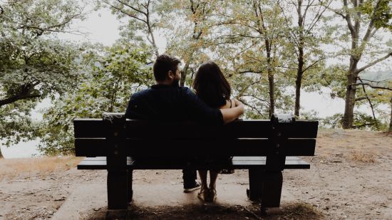 couple sitting at a bench