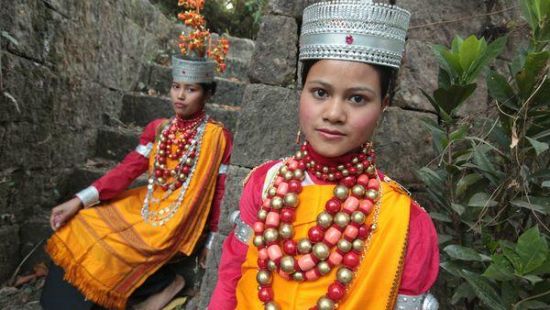 two people dressed in their native dress of cherrapunji
