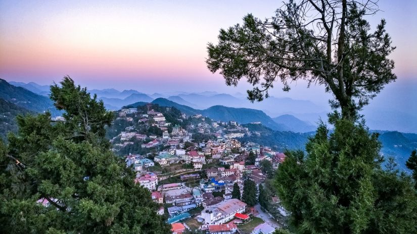 Uphill view of a town whilst the sunset