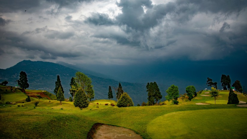 lush green deolo hills under an overcast sky