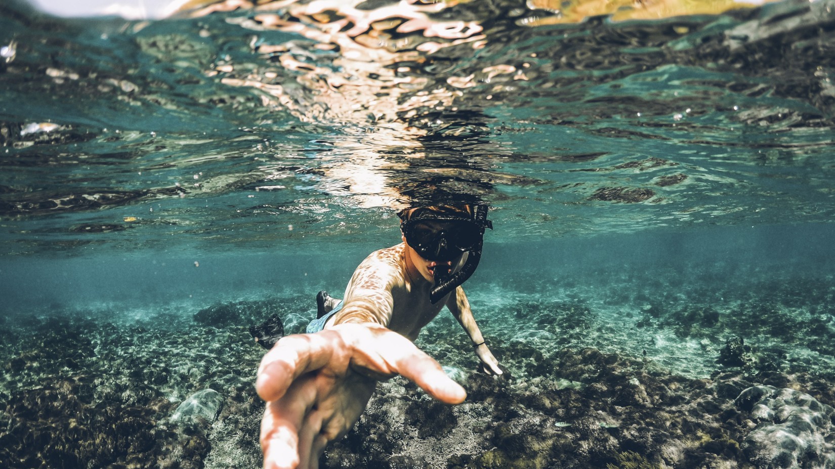 A man  underwater diving at Galle 