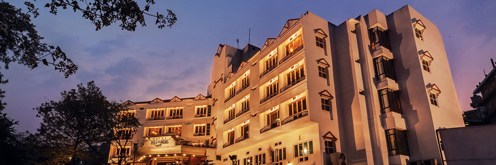 the exterior facade of Polo Towers hotel in Shillong with the evening sky in the background