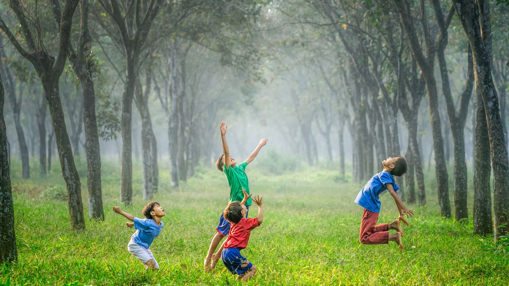 A group of children playing in a park - Best vacations near Delhi