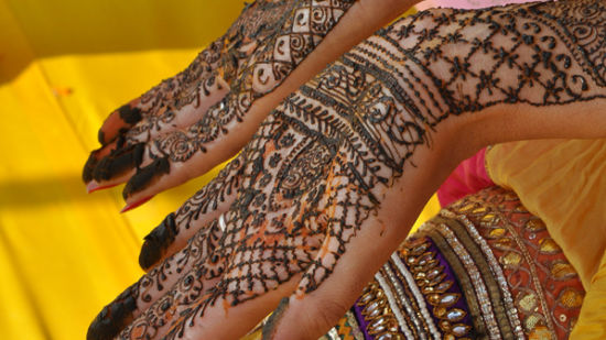 Deo Bagh - 17th Century, Gwalior - a woman showing her hand designed in mehndi