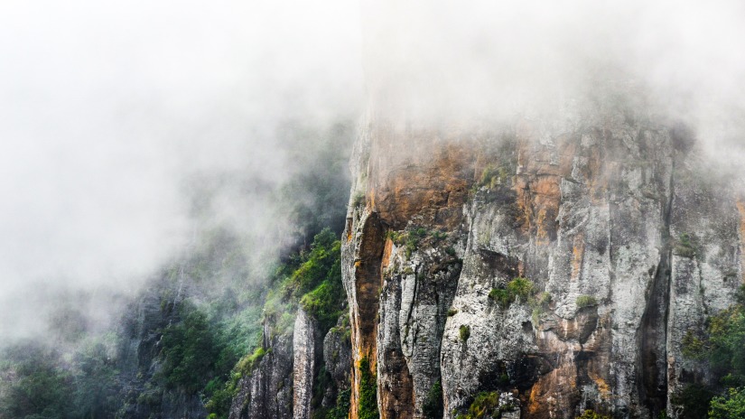 A view of Pillar Rocks in Kodaikanal surrounded by fog