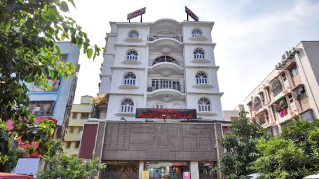 Facade view of Ecotel Kolkata with other building next to it