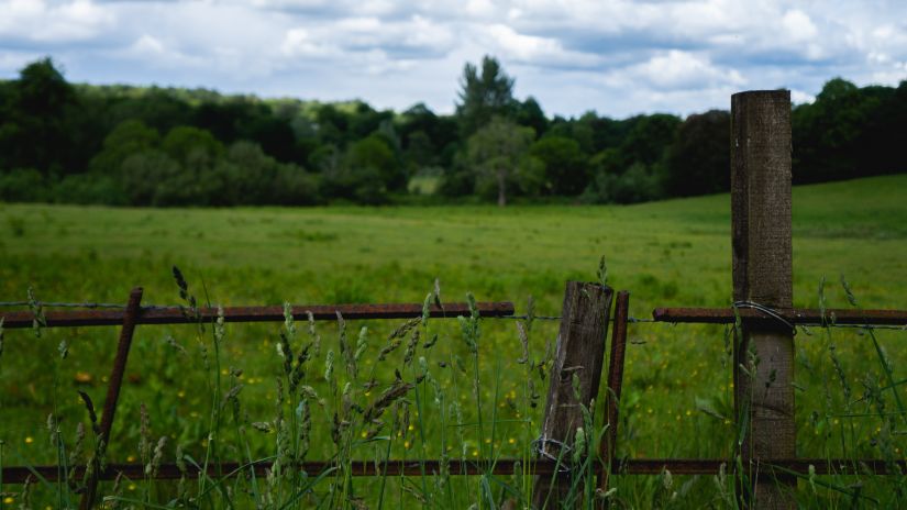 a wooden fence around a field