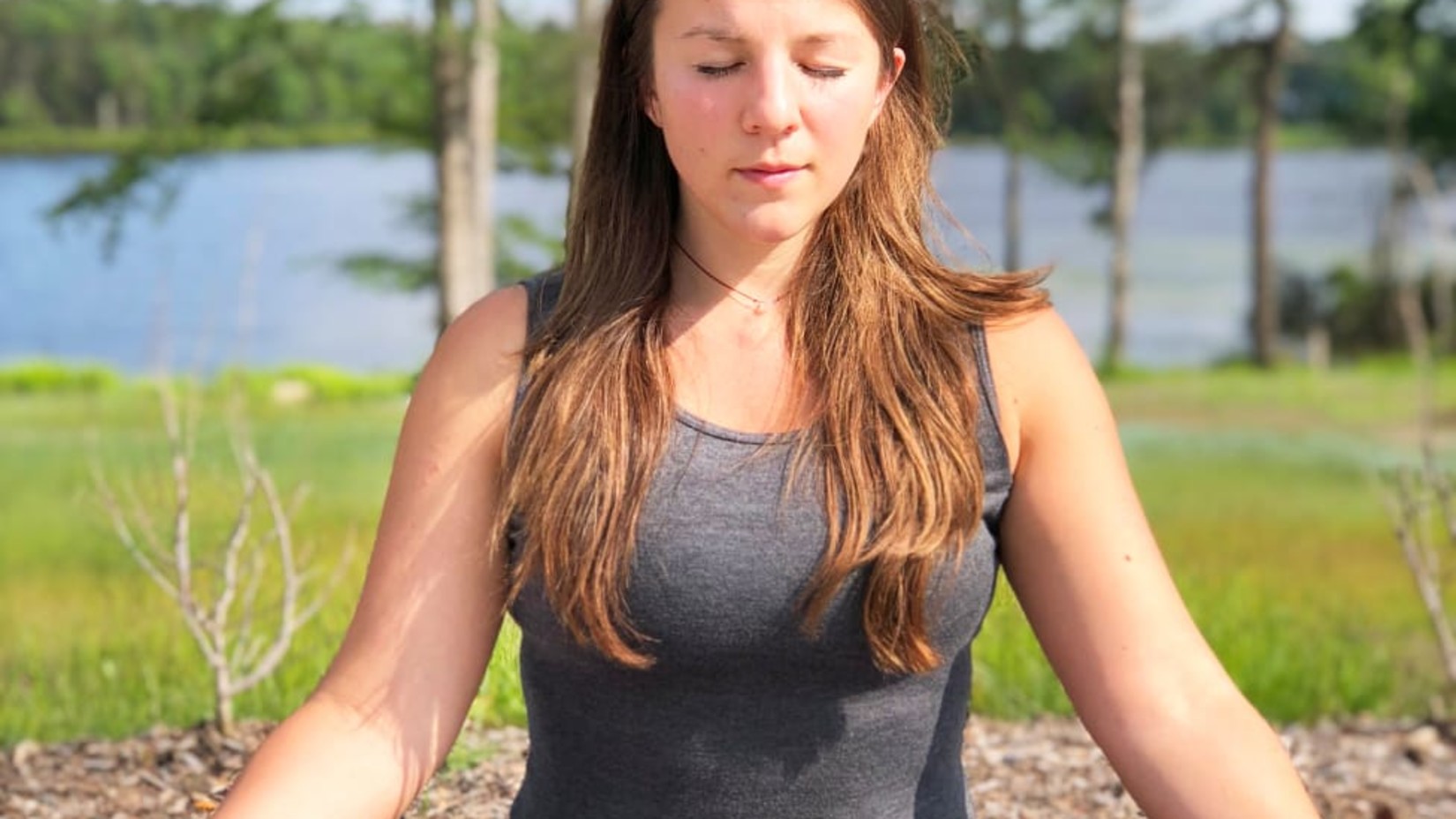 A girl meditating in a park