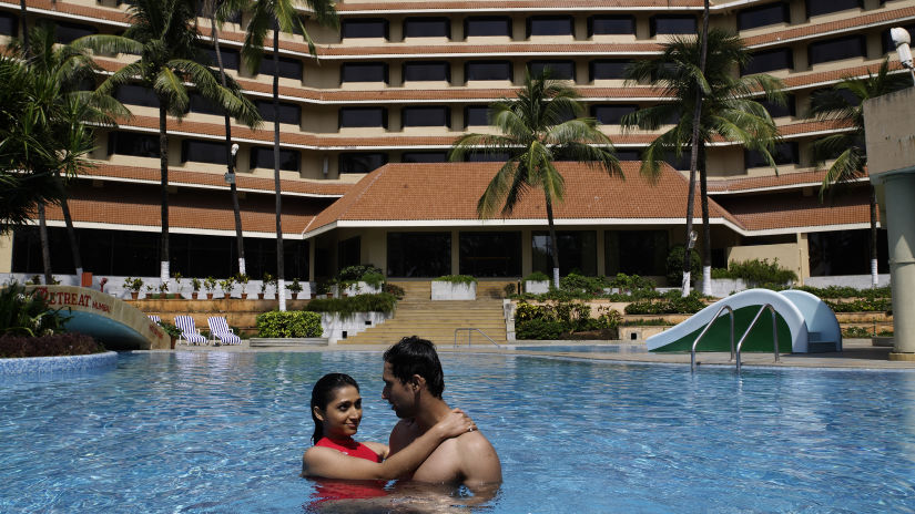 people relaxing in the Swimming Pool at our Madh Island Resort