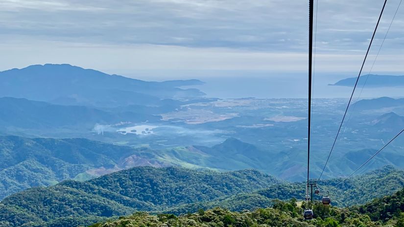 a cable car between mountains 