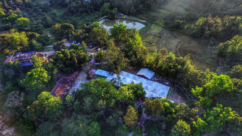 Aerial view of Capitol Village Resort, Madikeri with tree surrounding it