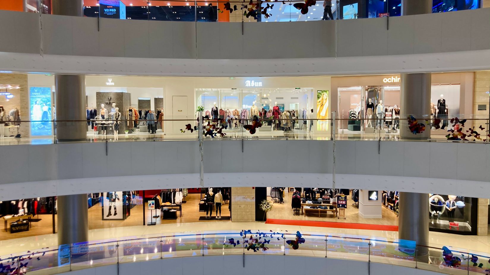 Different stores on 3 floors of a mall