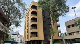 Another angle of the facade image of a building with a large tree in front - VITS Select Kharadi, Pune