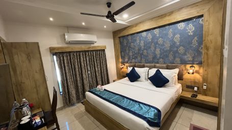 Side view of the Deluxe room with a cosy king-sized bed at Clarks Collection, Somnath