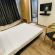 Image of a room at Sanctum Suites Richmond Road Bangalore with a double ed and a TV inside it