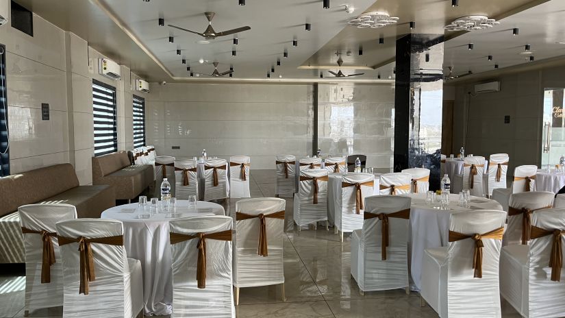 Image of Banquet Area with Circular Arrangement of Seating Tables at  Clarks Collection, Somnath