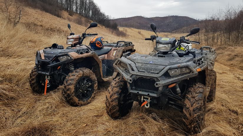 two ATV vehicles parked in an area surrounded by mountains and captured during the day @ Lamrin Norwood Green, Palampur