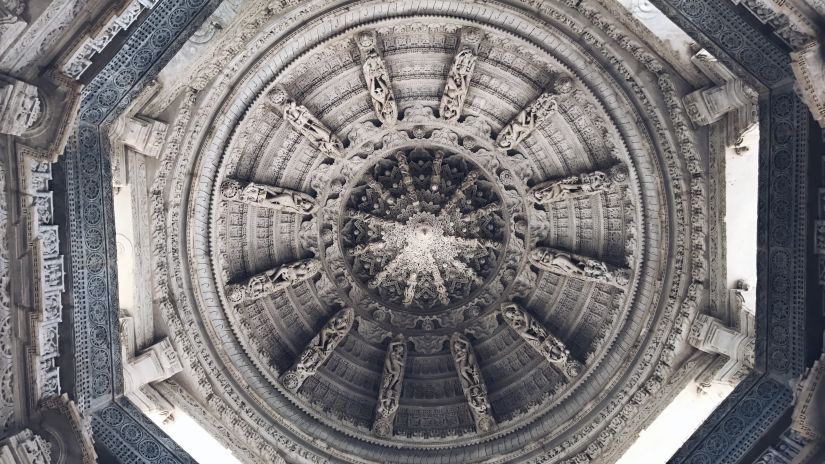 a roof at a temple with intricate mesmerising carvings on it