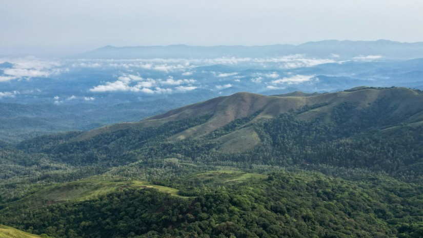 A view from Mullayanagiri Peak with clouds and mountains in view