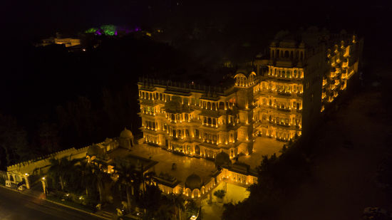 Aerial view of Chunda Hotels in the night with the lights on and darkness in the background