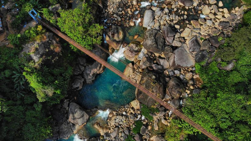 water flowing under the bridge in Meghalaya