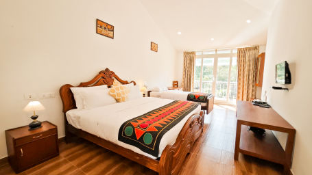 twin beds in premium room with a balcony offering serene mountain views1 - Ibex Stays & Trails, Valparai (Mistly)