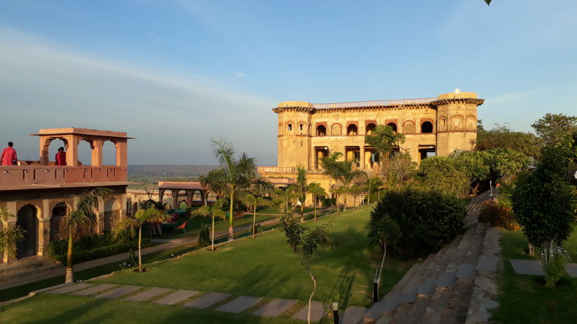 Facade in the background with garden in front_ Tijara Fort-Palace - 19th Century Alwar. Palace Hotel In Rajasthan