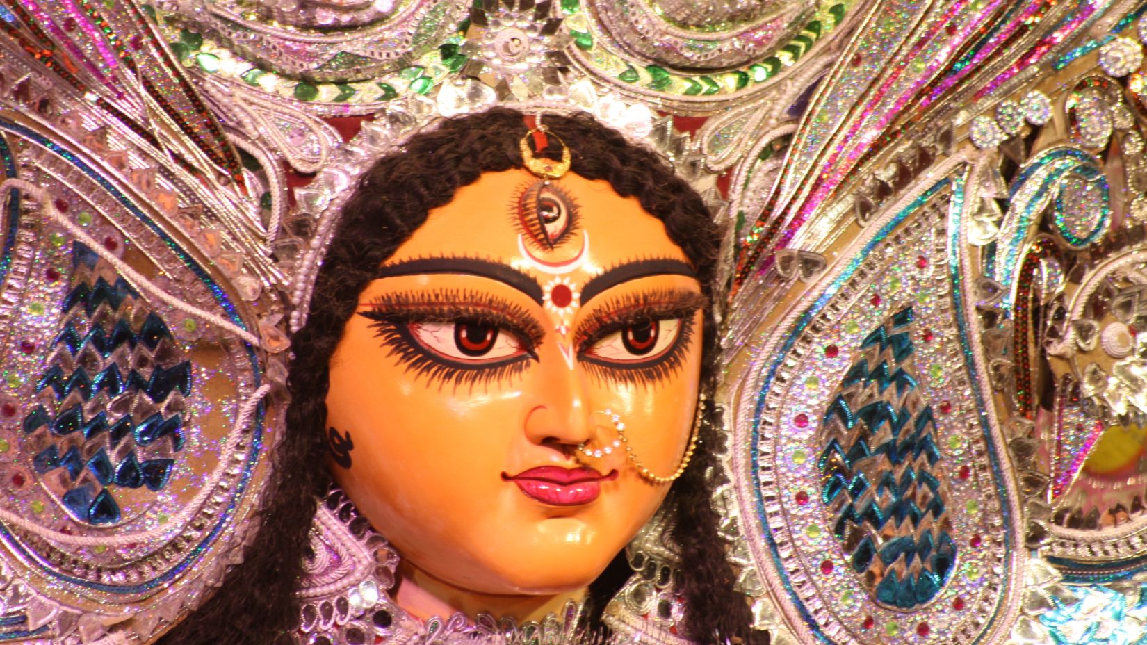 a close-up shot of the face of devi durga