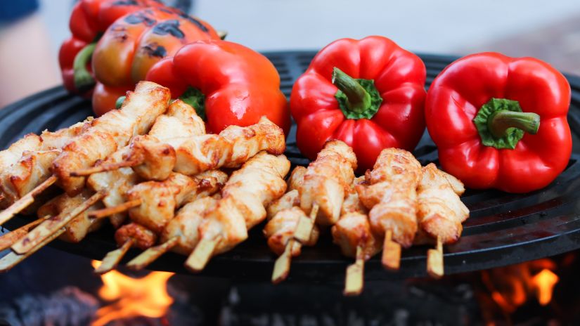 grilled food in a plate with red bellpepper 