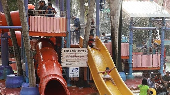 Water Kingdom - a group of people in a play area at our water park